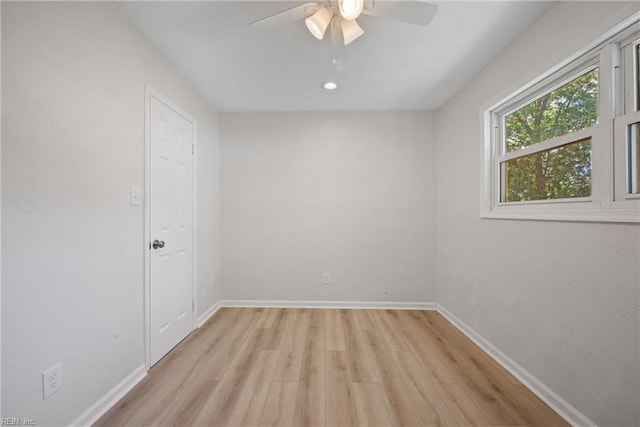 unfurnished room featuring light hardwood / wood-style flooring and ceiling fan