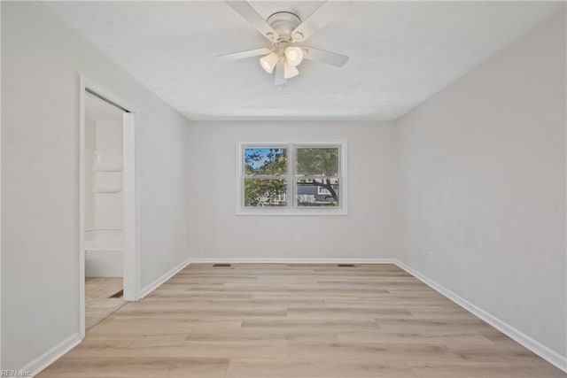 spare room with ceiling fan and light hardwood / wood-style floors