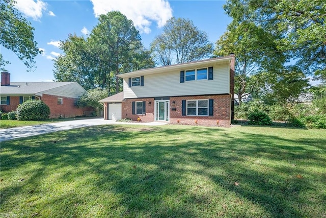 view of front of home featuring a front yard and a garage