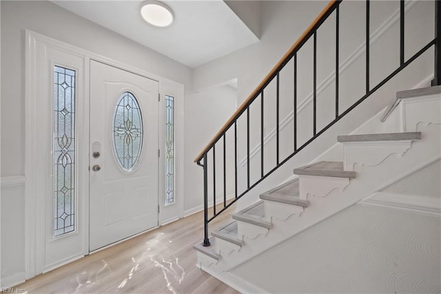 foyer entrance with light wood-type flooring