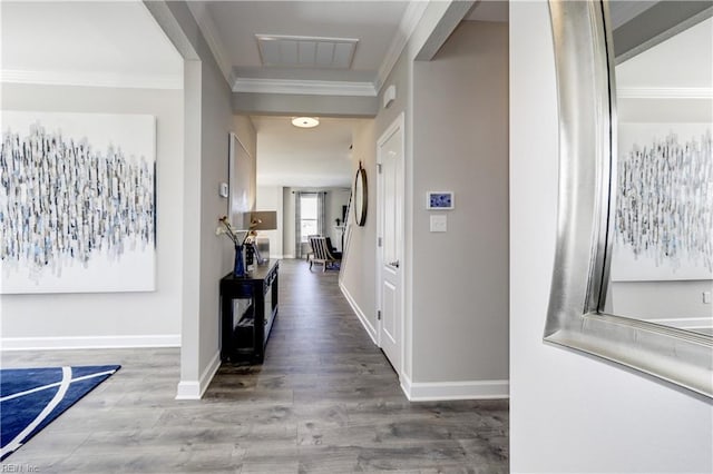 hall with hardwood / wood-style floors and crown molding