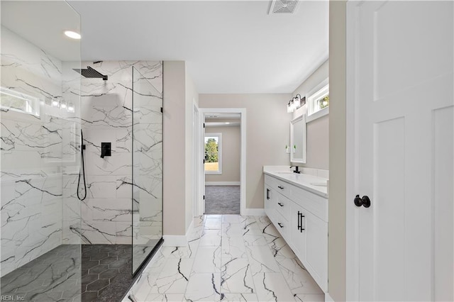 bathroom featuring vanity and a tile shower