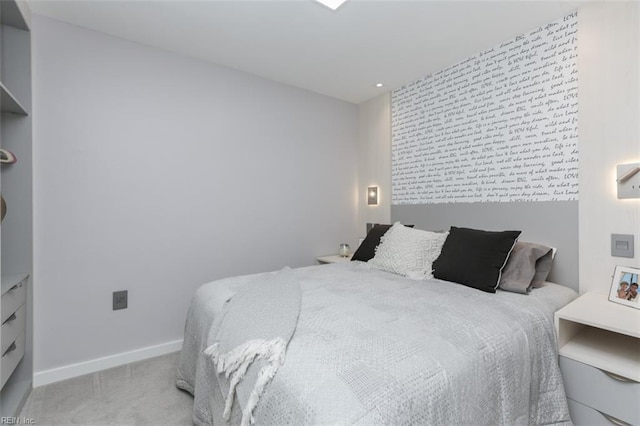 40 Rader St Unit 507, Norfolk, VA 23510 - bedroom with light carpet, an accent wall, and baseboards