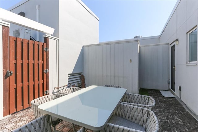 40 Rader St Unit 507, Norfolk, VA 23510 - view of patio featuring outdoor dining space, a gate, and fence