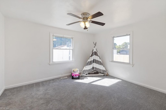 game room featuring ceiling fan, plenty of natural light, and carpet floors