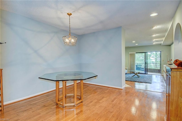 dining space featuring light wood-type flooring