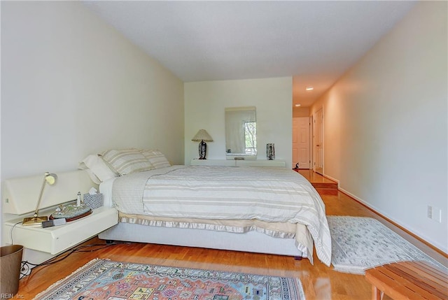 bedroom with wood-type flooring