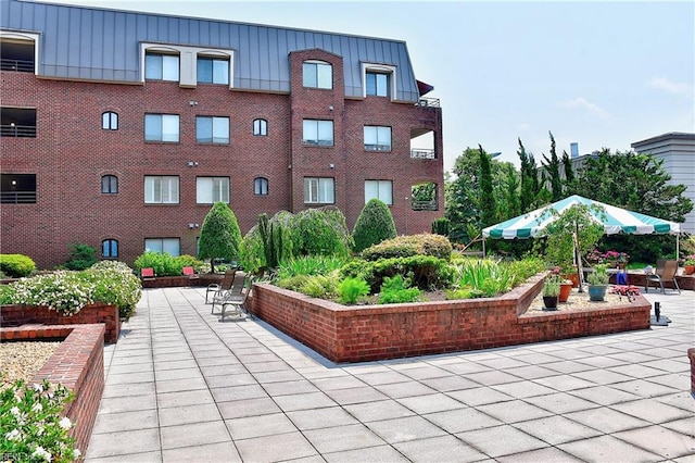 view of home's community featuring a patio