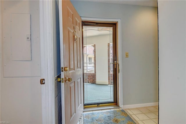 doorway with light tile patterned flooring, electric panel, and a wealth of natural light