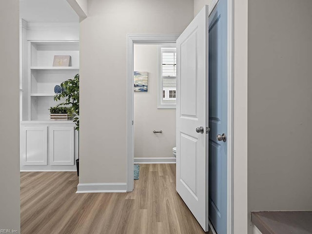 corridor with light wood-type flooring