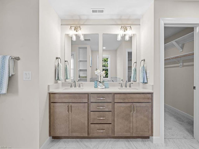 bathroom with beamed ceiling and vanity