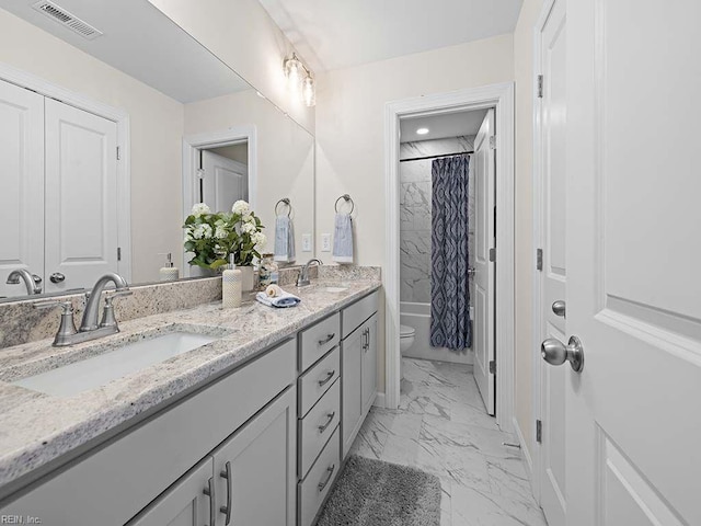 full bathroom featuring vanity, shower / tub combo, and toilet