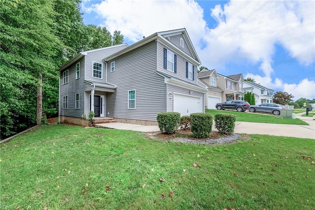 view of front of home featuring a garage and a front yard