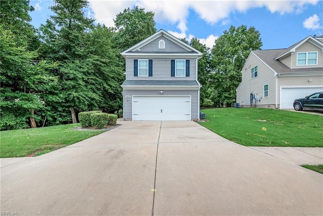 view of front of home featuring a garage and a front yard