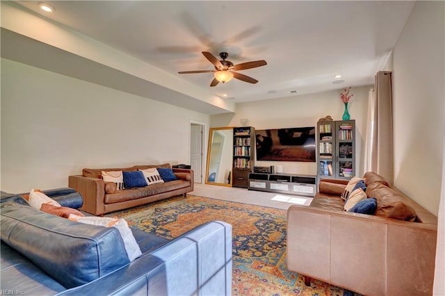 carpeted living room featuring ceiling fan