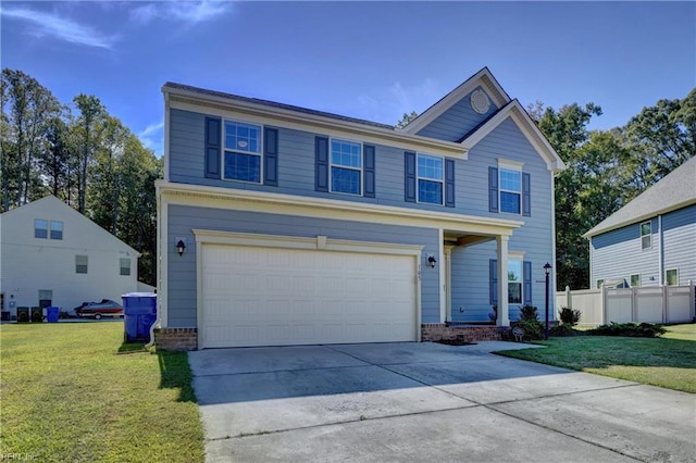 view of front of home with a front yard and a garage