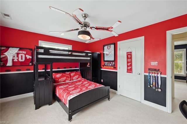 carpeted bedroom with ceiling fan