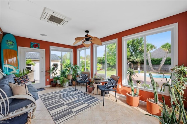 sunroom featuring plenty of natural light and ceiling fan