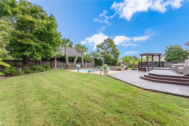 view of yard featuring a pool side deck and a pergola