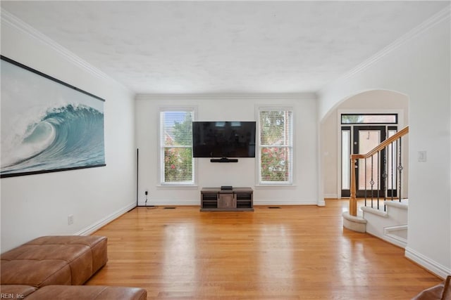 living room featuring light hardwood / wood-style flooring and crown molding