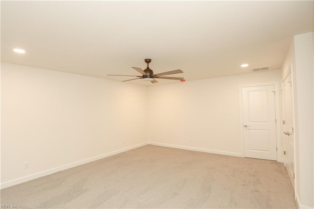 carpeted empty room featuring ceiling fan