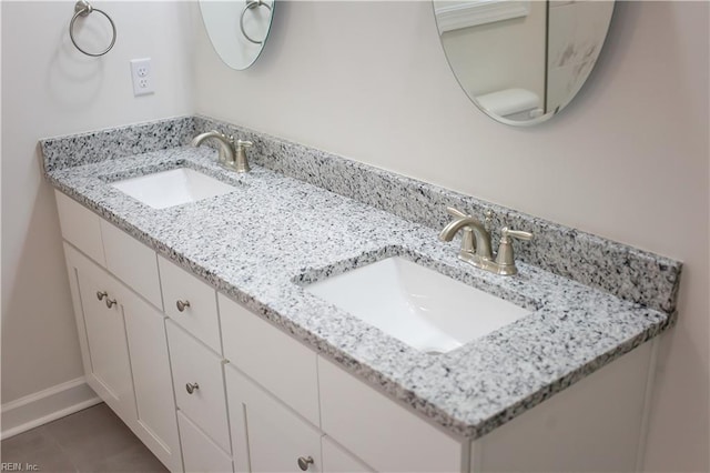 bathroom with vanity and tile patterned floors