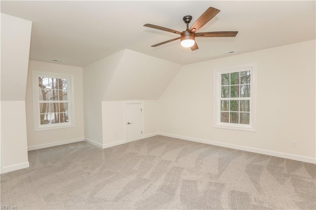 bonus room featuring light carpet, ceiling fan, and lofted ceiling