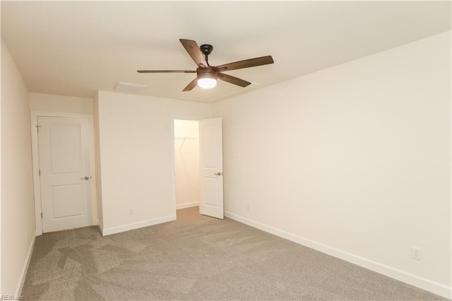 unfurnished room with light carpet and ceiling fan