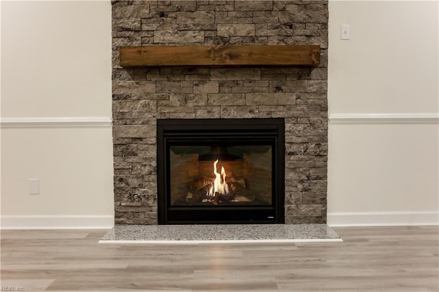 interior details with a fireplace and hardwood / wood-style floors