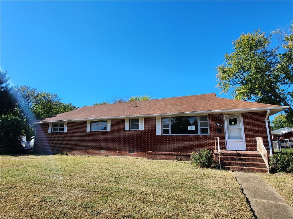 ranch-style house with a front lawn