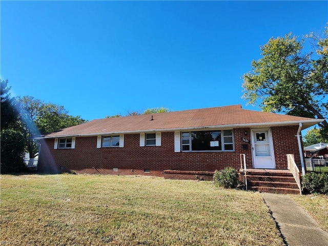 ranch-style house with a front lawn