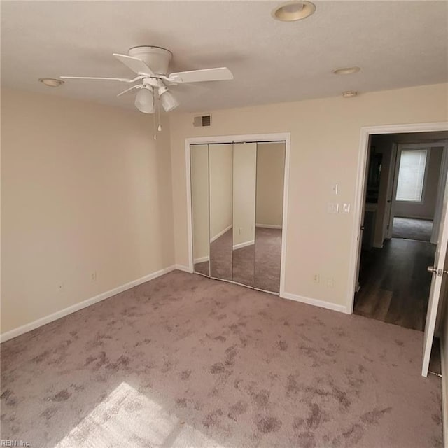 unfurnished bedroom featuring carpet and ceiling fan