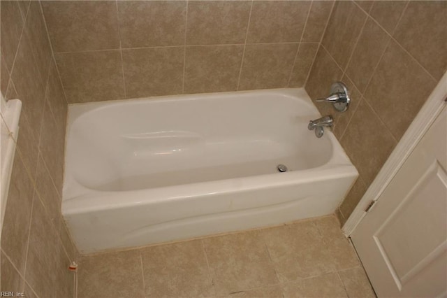 bathroom featuring a bath and tile patterned floors