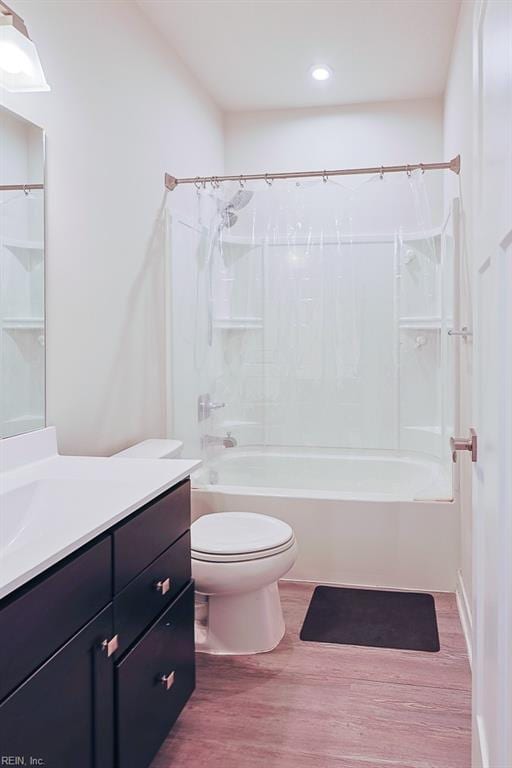 full bathroom featuring shower / tub combination, hardwood / wood-style flooring, vanity, and toilet