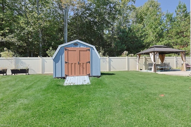 view of outdoor structure with a gazebo and a lawn