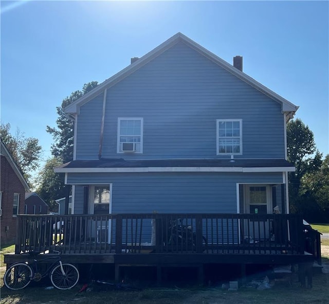 rear view of house with a wooden deck