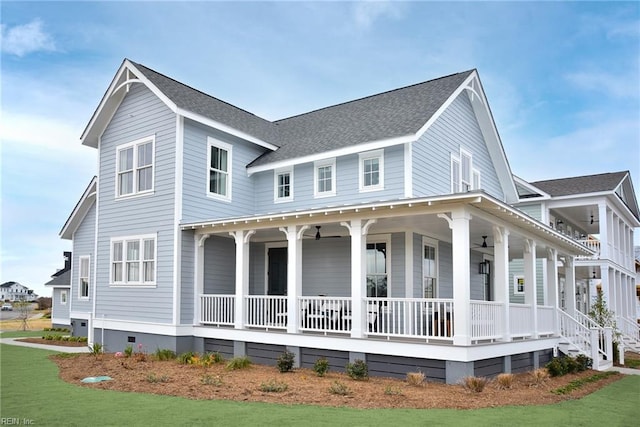 view of front of home featuring a front yard and a porch