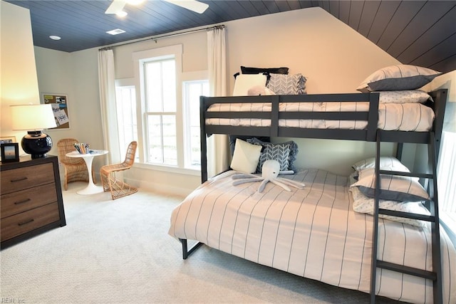 carpeted bedroom with lofted ceiling, ceiling fan, and wood ceiling