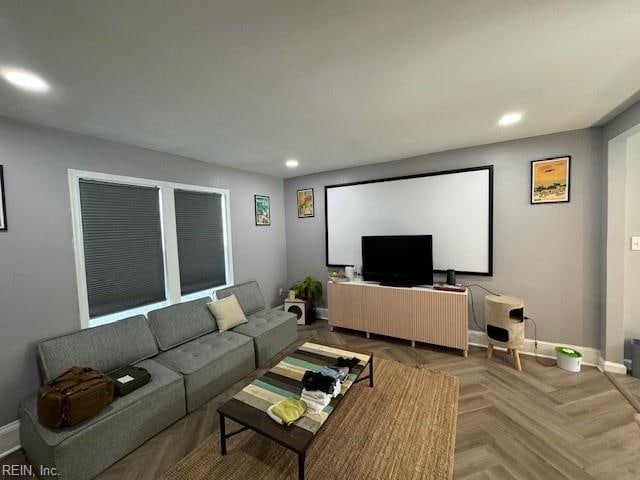 living room featuring parquet flooring