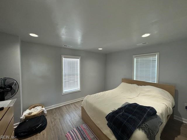 bedroom with hardwood / wood-style floors