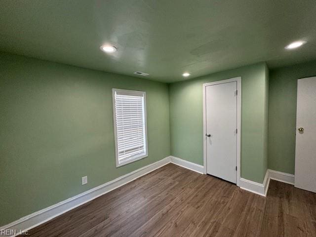 empty room featuring hardwood / wood-style flooring