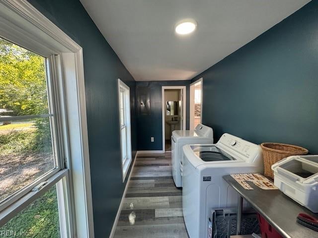 laundry area featuring dark wood-type flooring and washer and dryer