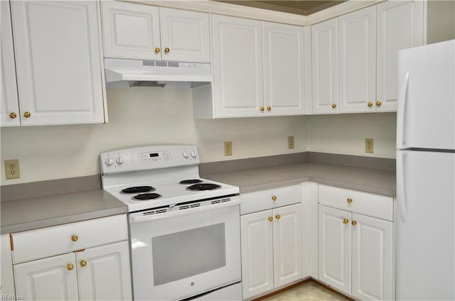 kitchen featuring white appliances and white cabinets