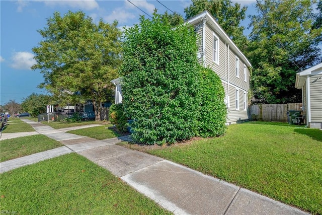 view of property exterior featuring a yard