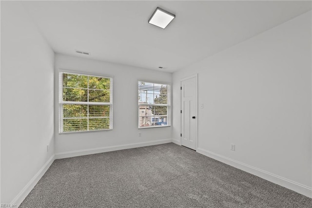 unfurnished room with carpet floors