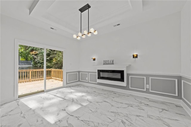 unfurnished living room featuring a raised ceiling, crown molding, and a chandelier