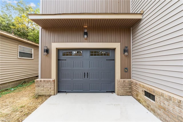 garage featuring wooden walls