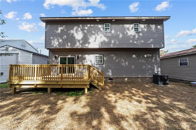 rear view of house with a wooden deck and central AC unit