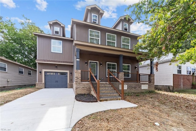 view of front of property with a garage and a porch