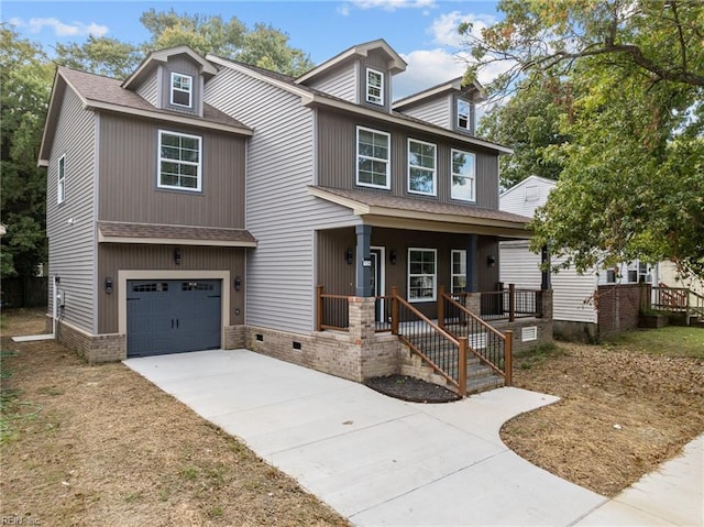 view of front of house featuring a porch and a garage